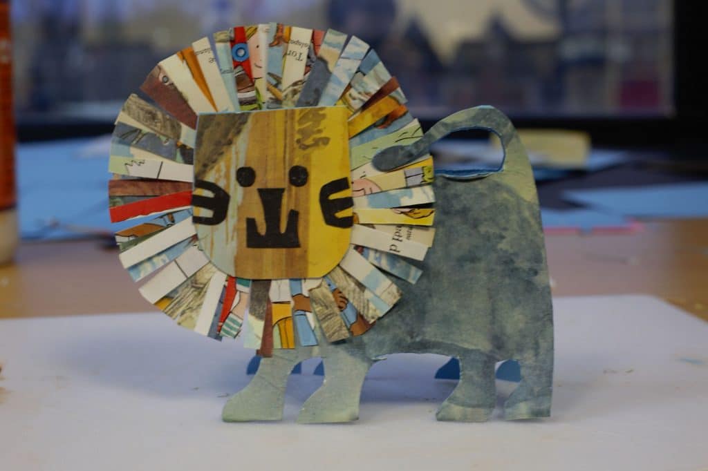 Lion crafted out of card and old books